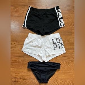 VS Pink shorts and a pair of swim bottoms